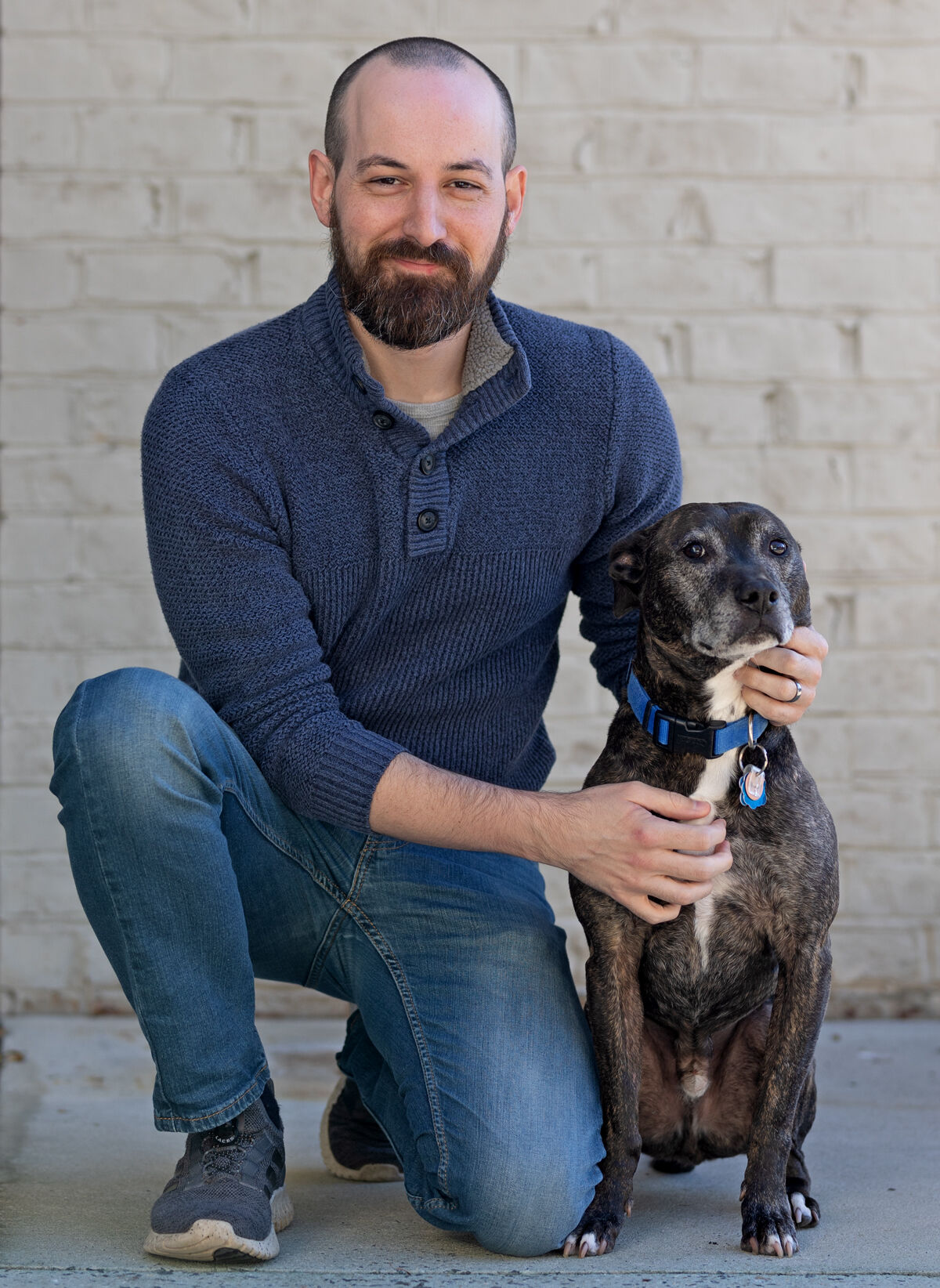 Boulton Creative web developer Eric Michel with assistant Ruckus